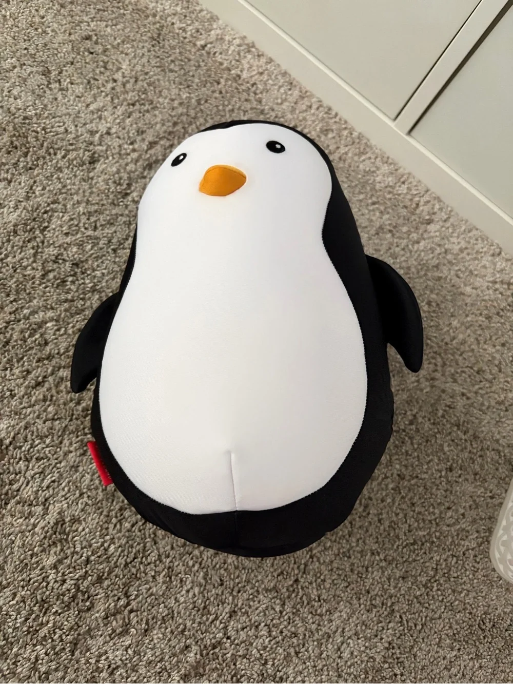 Kikkerland Black White Penguin Plush with Orange Beak (turns into travel pillow)